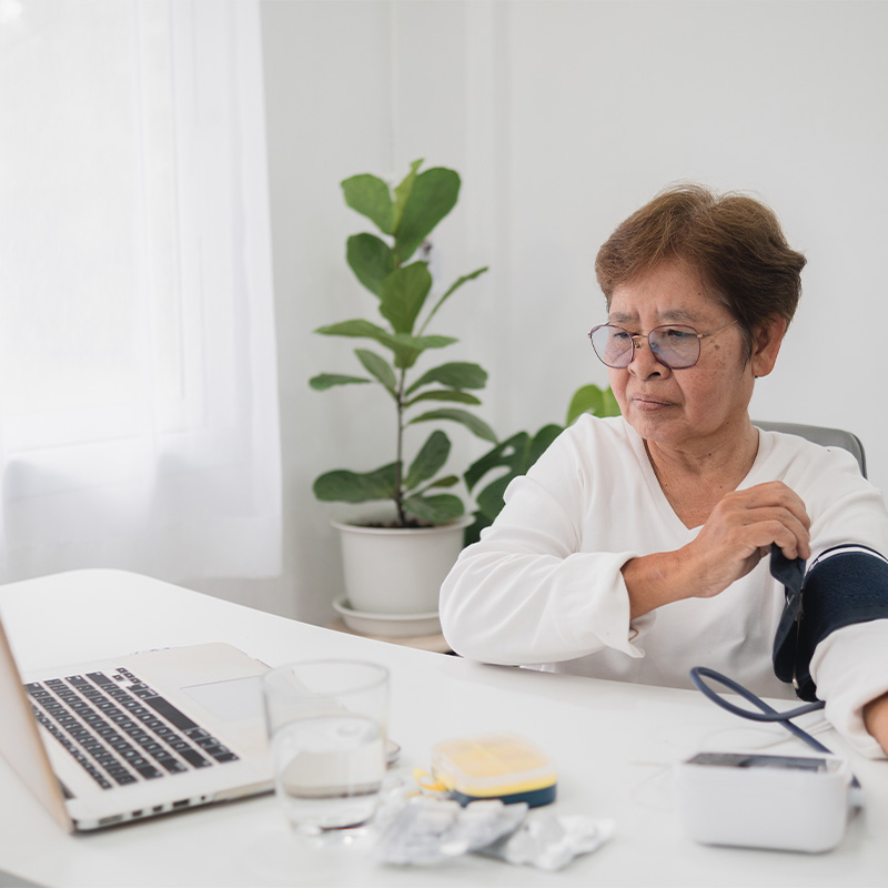 elderly lady talking to dr on video chat